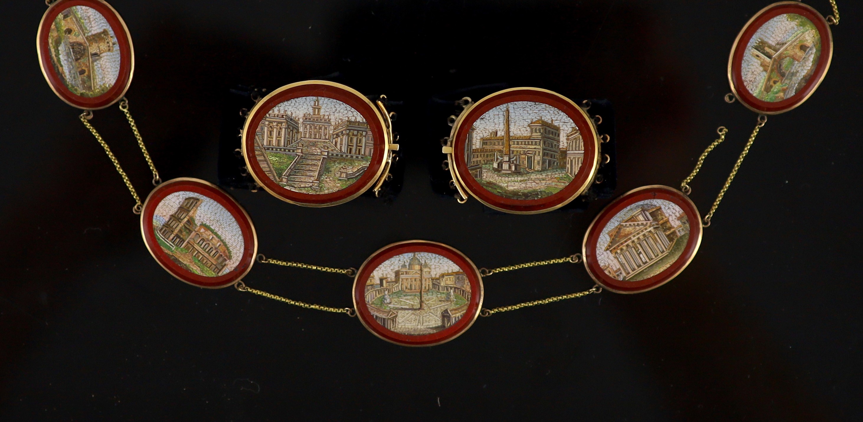 A 19th century Italian Grand Tour Souvenir gold mounted micro mosaic plaque necklace and a pair of matching bracelets Plaques 2cm-3cm., overall 42.5cm.